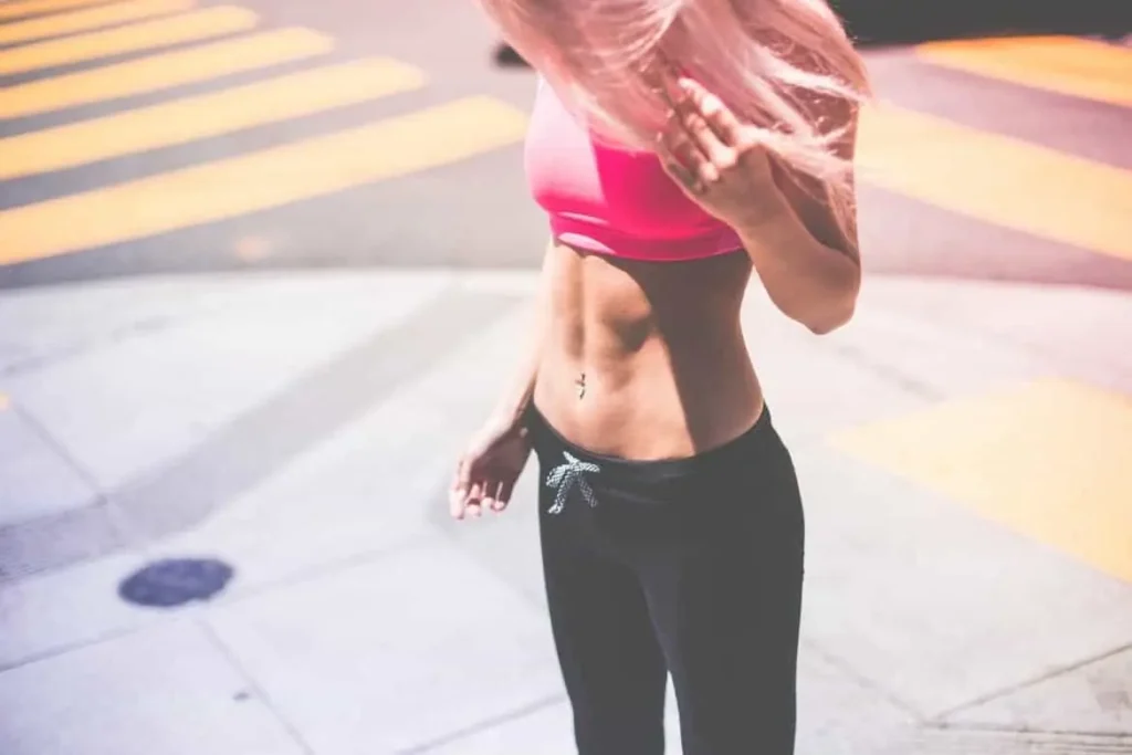 Woman with toned stomach after LA-EMS Body Sculpting Treatment Borehamwood